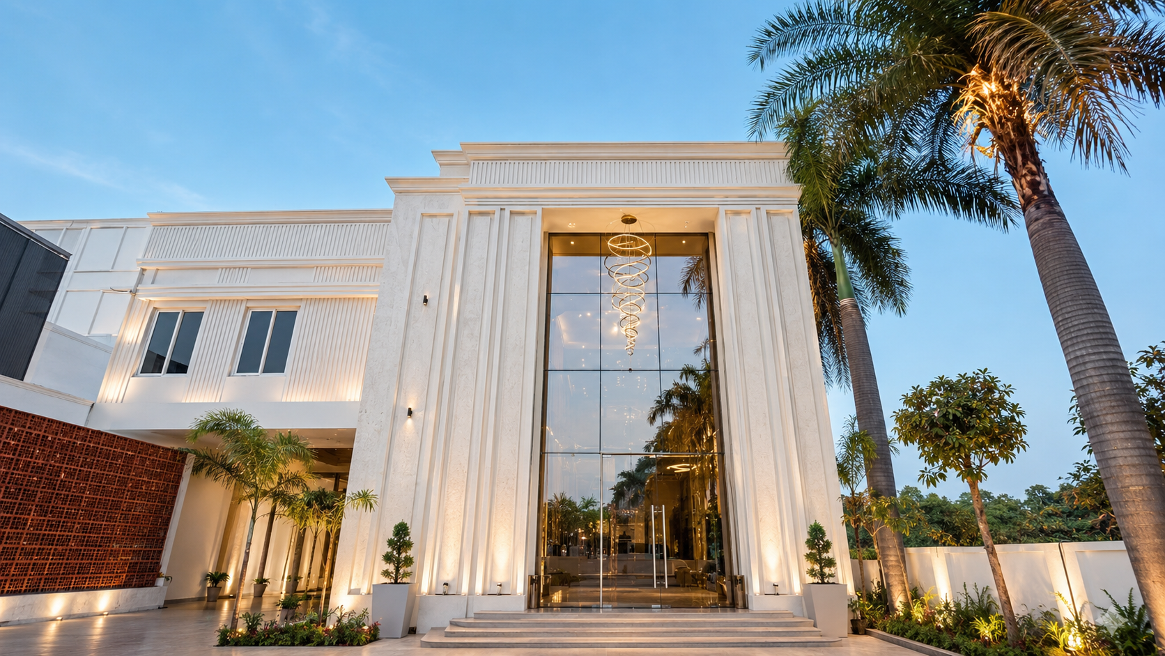 Om Sai Ram Hotel exterior at twilight